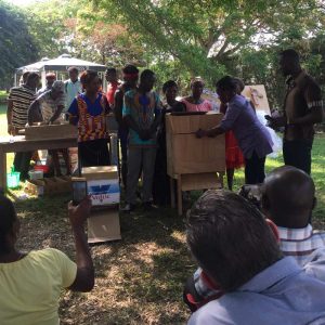 A group of people engaged in the Asase Foundation's Project Cash It!